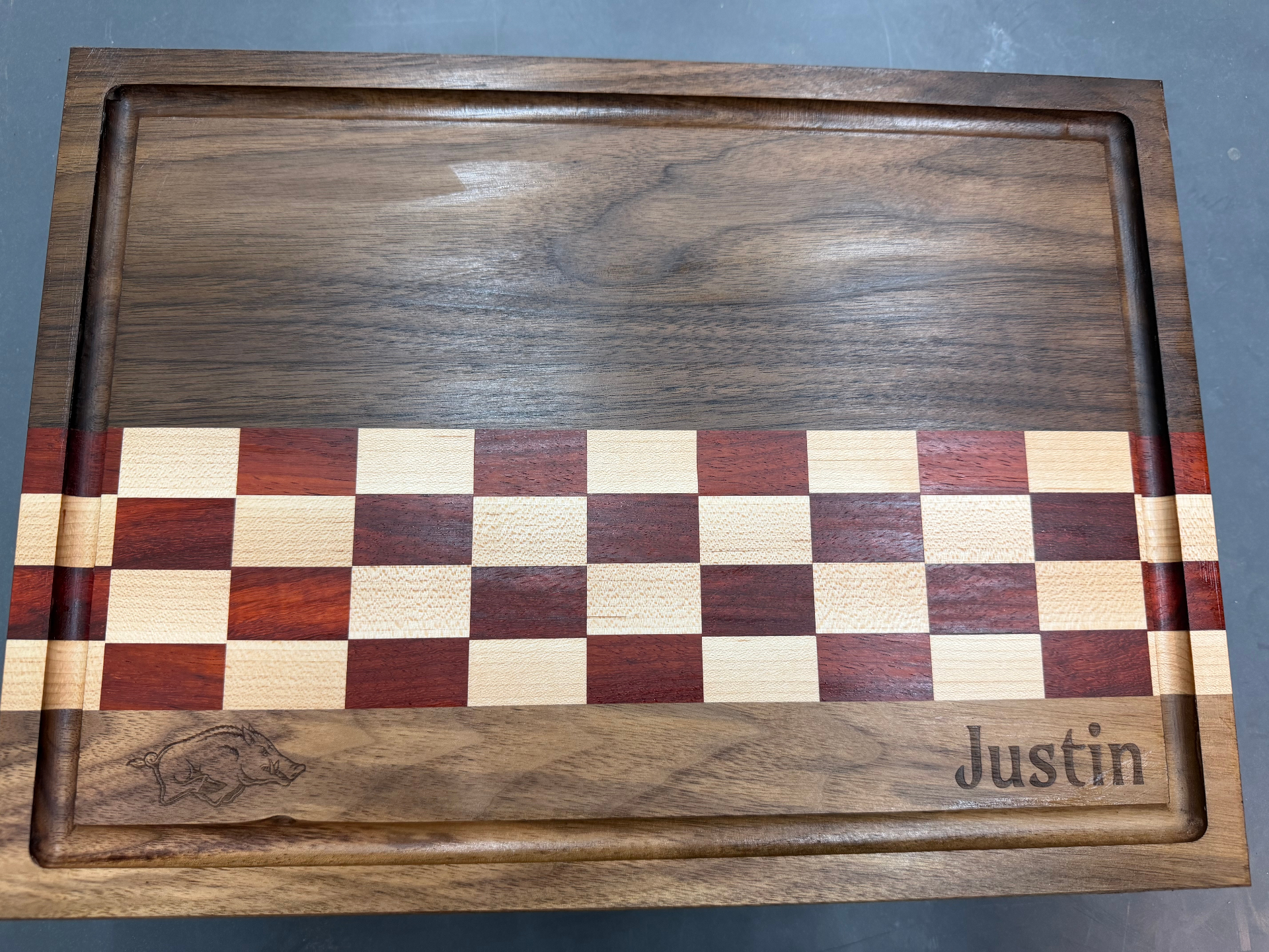 Razorback cutting board with juice groove, checker stripe, and engraved Razorback