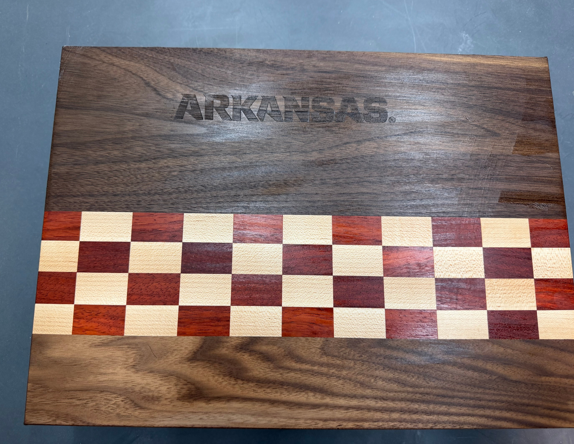 Razorback cutting board with Arkansas engraving and checker stripe